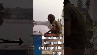 The madman sitting on the risky edge of the bridgeAmazing World Views [upl. by Githens]