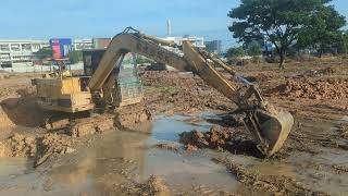 Excavator CAT E 240B and CAT E 70B working at job site [upl. by Aivatnuahs]