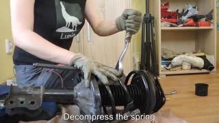 How to replace a spring an upper strut mounting and a bearing  Mazda 626 [upl. by Selassie864]