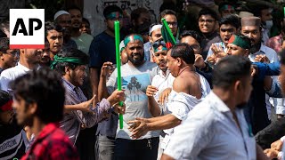 Bangladesh protesters attack supporters of Sheikh Hasina and harass journalists [upl. by Nnaeinahpets534]