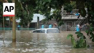 Tropical storm battering Philippines leaves at least 24 people dead [upl. by Aivekahs460]