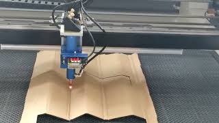 CO2 laser cutting machine cutting cardboard [upl. by Nossila101]