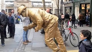 Golden man London street performer floating and levitating trick Covent Gardens [upl. by Nordine]