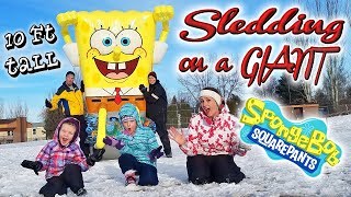 BEST SNOW DAY EVER Sledding on Inflatable Floaties GIANT Spongebob Square Pants Pool Float Toy [upl. by Aikenahs672]