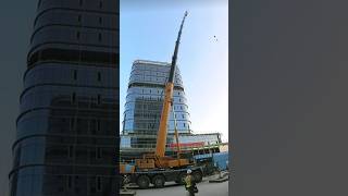 The process of a truck crane operating during strong winds [upl. by Ronym]