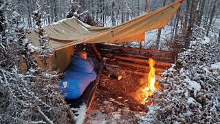 Winter Camping in Snow Storm with Survival Shelter amp Bushcraft Cot [upl. by Toomin318]