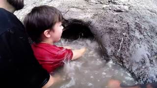 Noodling  Teaching 8yr old Son How to Noodle Catfish Catching Fish by Hand [upl. by Ennayelsel]