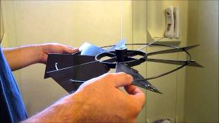 Balancing a decorative windmill using coins to remove vibration [upl. by Leander]