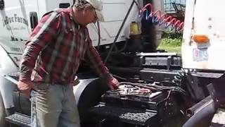 Farmer shows how to deal with semi truck batteries [upl. by Zita]