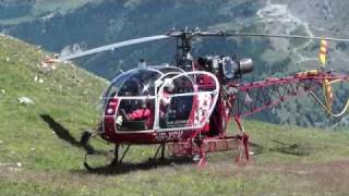 Air Zermatt helicopter quotLamaquot taking off in the mountains  takeoff [upl. by Pownall318]