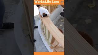 A worker uses a tool to add a wood grain texture to a painted handrail for a natural finish [upl. by Lemmuela72]