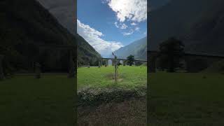 Bernina Express train on the Brusio Spiral near Poschiavo Switzerland mountains railway travel [upl. by Raymonds]