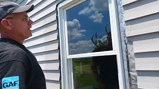 cutting vinyl siding on the wall after installing a new construction window [upl. by Kori]