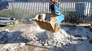 Elvington Plant Hire Crusher Bucket crushing Reinforced Concrete and Blockswmv [upl. by Alla311]