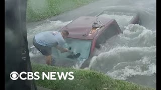 Dramatic video shows Texas couple rescuing truck driver from flooded ditch [upl. by Hajin]