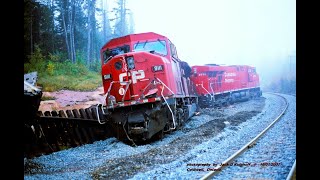 CP SD90mac 9137 west passes WRECK SITE Train 104 rear ends 116 Coldwell siding 10012007 [upl. by Rodl]