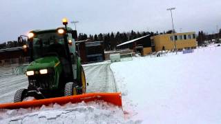 Snowplowing with John Deere 3720 [upl. by Acirrej679]