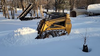 Skid Steer With Steel Grouser Tracks in Deep Snow [upl. by Lihcox904]