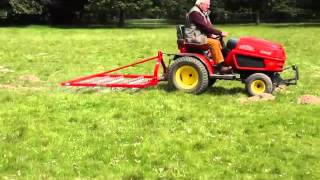 SCH 60quot Four Row Scarifying Rake on 3 Point Linkage on grass [upl. by Homer]