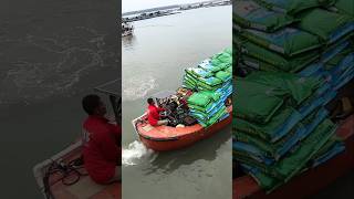 With the help of this boat this man loads sacks of salt and takes them to the ships [upl. by Vizza]