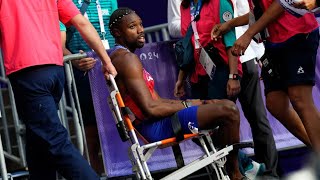 Noah Lyles 200m final American sprinter carted off in wheelchair after receiving medical attention [upl. by Adlez]