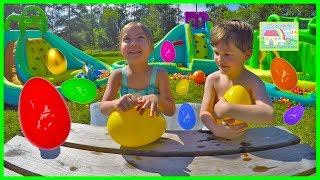 Giant Surprise Egg Hunt on Huge Little Tikes Inflatable Water Slides Outdoor Play [upl. by Mckenna116]