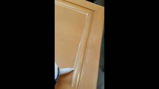 Caulking kitchen cabinets doors prior to painting [upl. by Tillo]