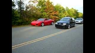 VW Golf R32 Vs Ferrari Modena 360 [upl. by Ahsitahs]