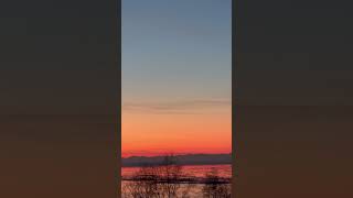 Captain Cook Peers Over Namesake Waters as they Reflect Glowing Sunset above Alaska Range amp Mt Spurr [upl. by Siduhey410]