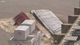 Runaway barges strike dam at least one sinks [upl. by Tombaugh]