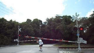 Railroad Crossing Gate Malfunctions Hits Man On The Head [upl. by Lanza17]