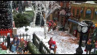 Christmas Village Displays  with Lemax houses Department 56 models trees snowmen and figurines [upl. by Enomor]