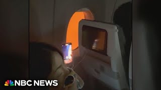 Video shows passengers stuck on burning plane in Japan [upl. by Aisatsan]