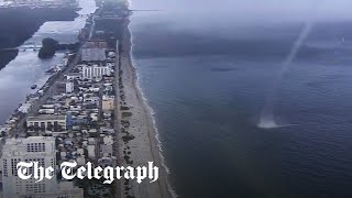 Waterspout crashes on to beach full of people in Miami Florida [upl. by Annelak]