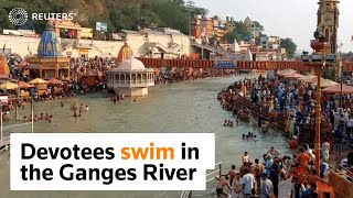 Devotees take holy dip in Ganges [upl. by Irrab]