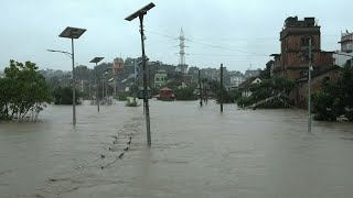 Torrential rain triggers deadly flooding in Nepal  AFP [upl. by Onidranreb]