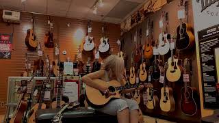 Trying out a Taylor guitar at Sam Ash music store [upl. by Frayda626]