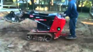 Toro Dingo TX 525  grading with spilt bucket [upl. by Finah501]