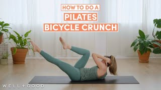 How to do A Pilates Bicycle Crunch  The Right Way  WellGood [upl. by Primrosa]