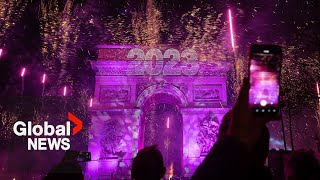 New Years 2023 Paris France gets the party started with fireworks smoke show over Arc de Triomphe [upl. by Buote885]