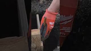 Building a concrete form for a fence post…with danger diy home homeimprovement [upl. by Yenttihw]