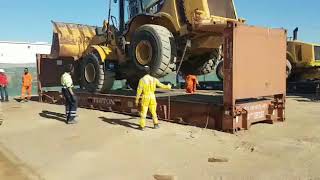 LOADING WHEEL LOADER INTO 40FT FLAT RACK SHIPPING CONTAINER [upl. by Marylynne]