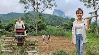 Two sisters hoe grass plow the soil and till the soil to make beds for the vegetable garden [upl. by Mariana]