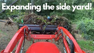 Moving brush and grading the hillside with forks and box blade [upl. by Eniluqcaj]