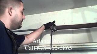 Garage Door Torsion Spring Repair  DIY Dangers Of Removing Torsion Springs [upl. by Obbard]