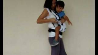 Manduca Baby Carrier Instructions  Switching from Side Carry to Front Carry Position [upl. by Trbor216]