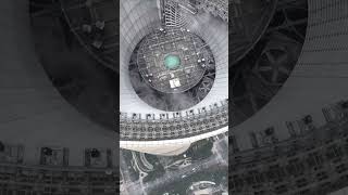 The top of Shanghai Tower seen from above skyscraper dronevideo [upl. by Anawat]