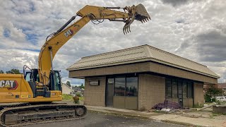 Caterpillar excavator crushes entire retail building [upl. by Ciryl134]