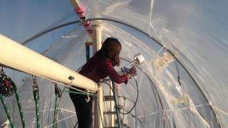 Shrinkwrapping a sailboat in the water with the mast up [upl. by Vida742]