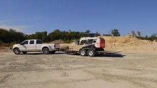 Unloading a Skid Steer on Tilt Bed [upl. by Kliber]